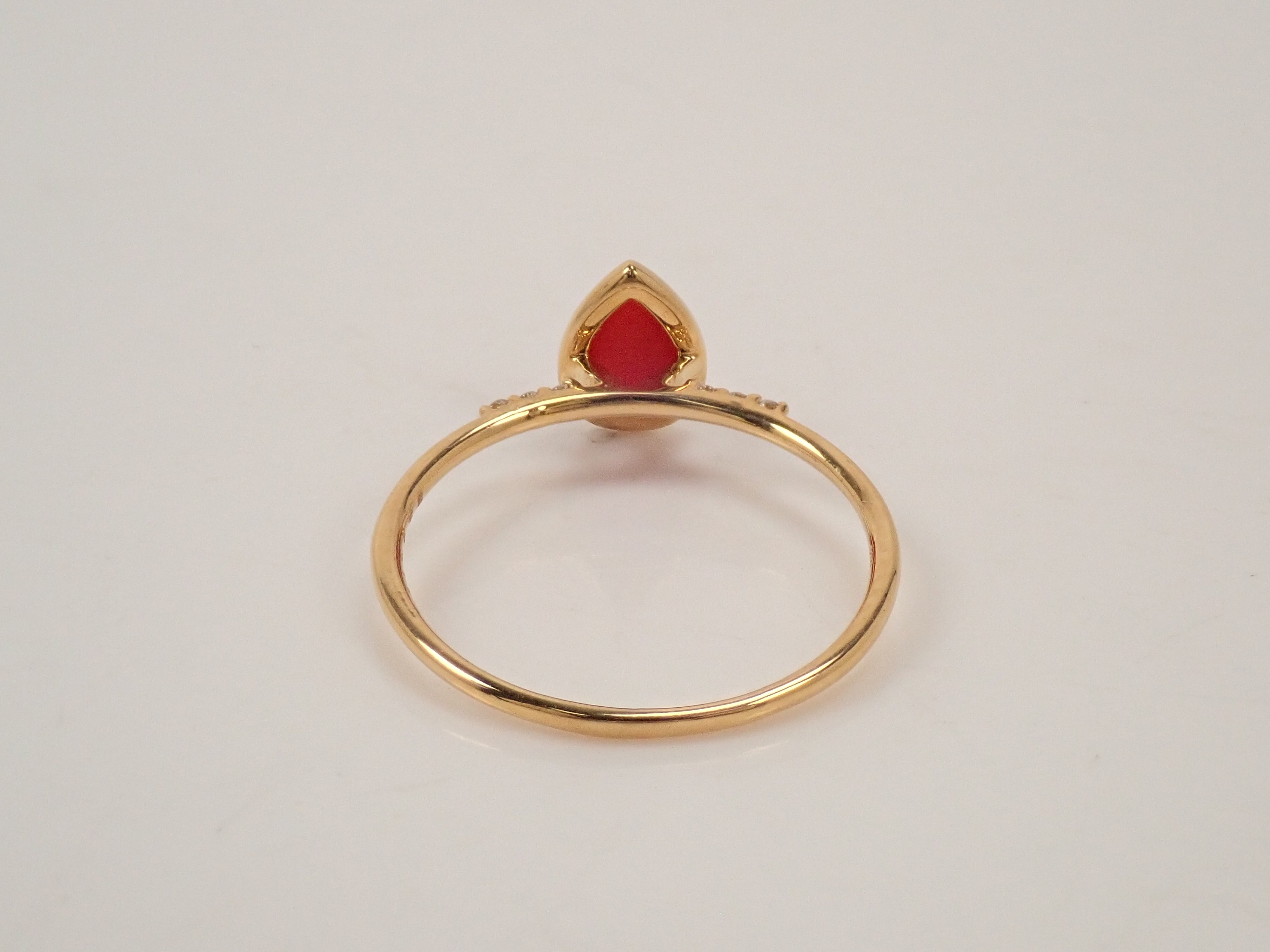 【22602551掲載】K18 血赤珊瑚 0.56ct リング