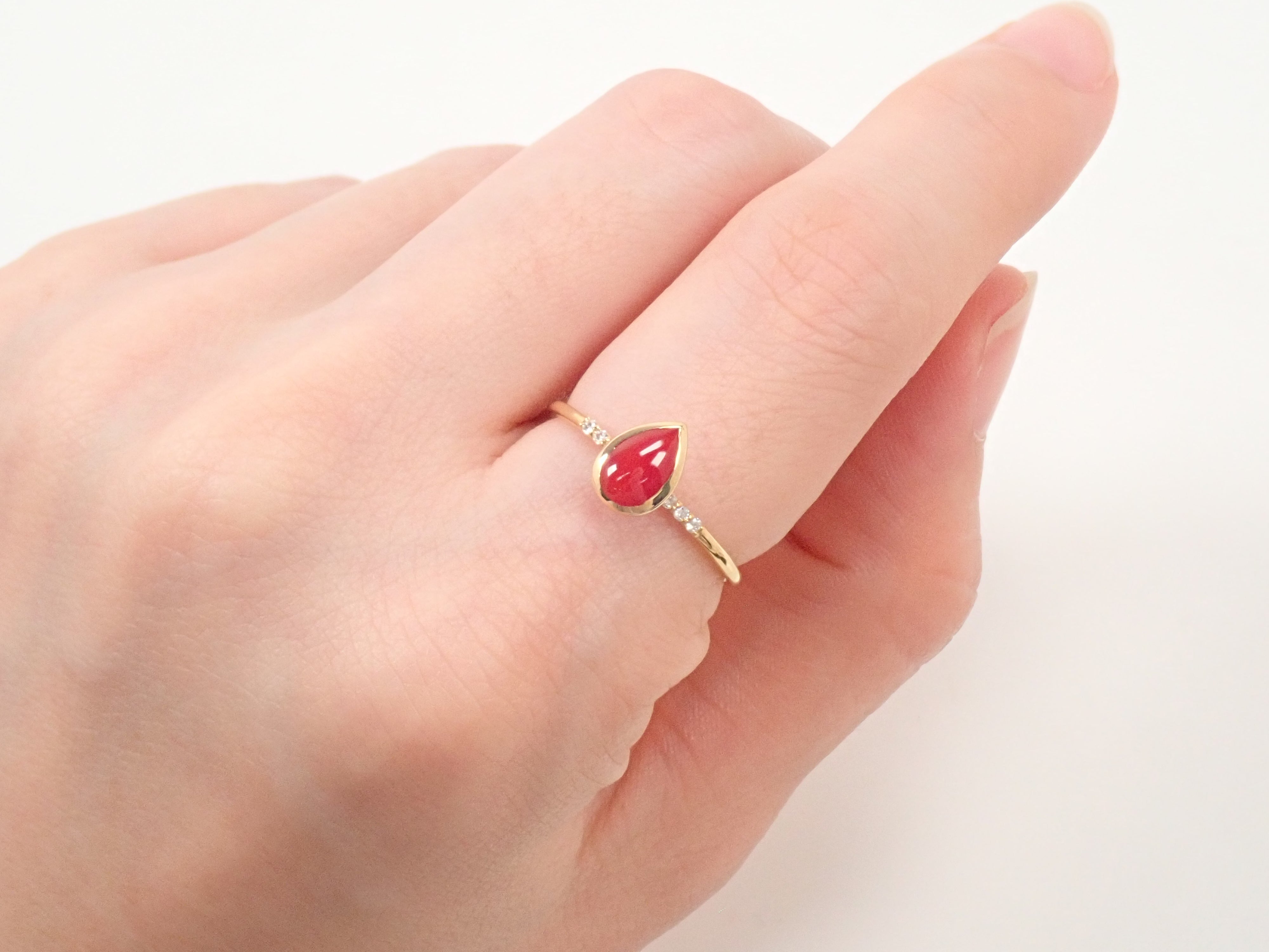 【22602551掲載】K18 血赤珊瑚 0.56ct リング