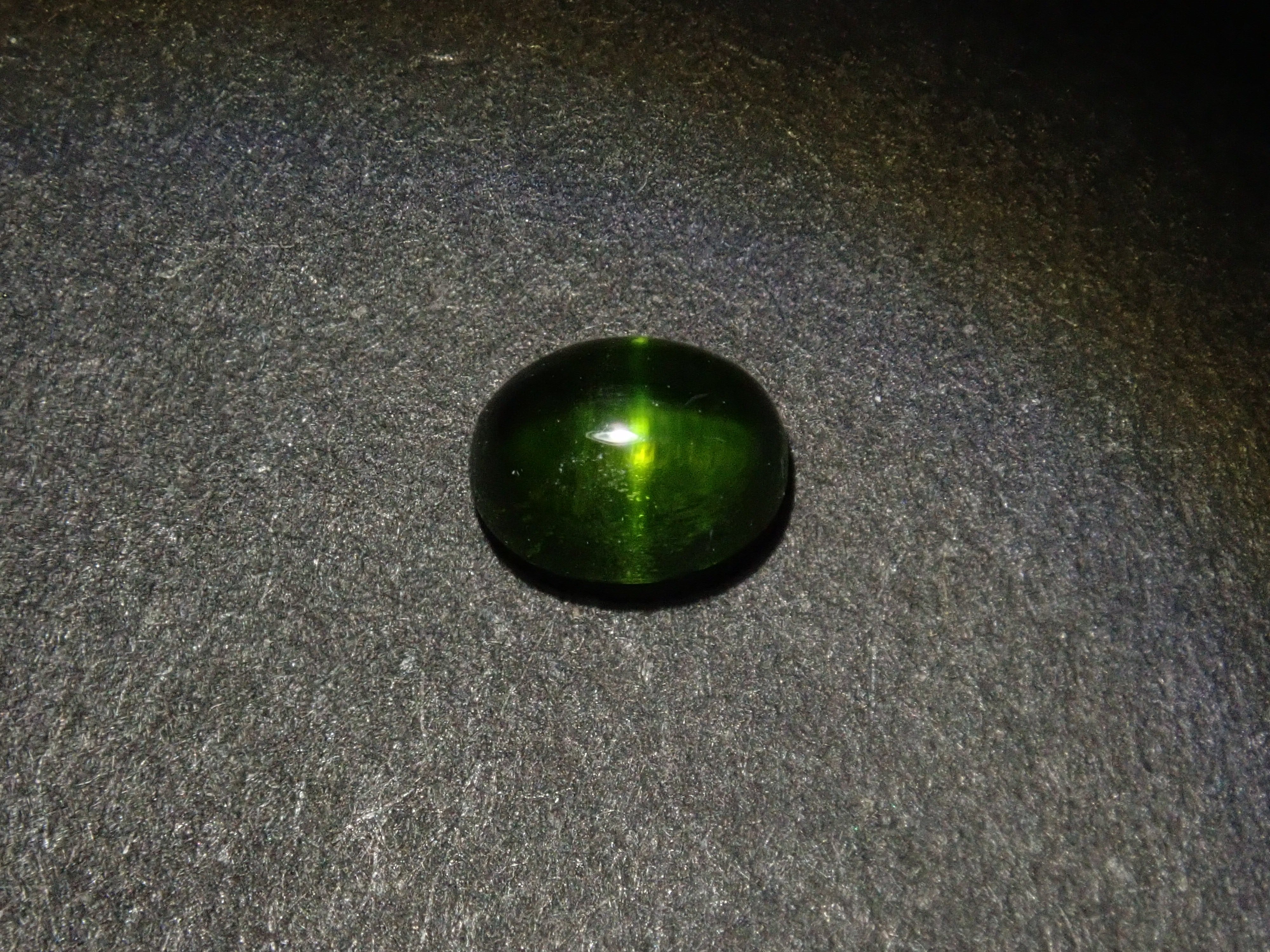 Limited to 7 stones: 1 loose enstatite cat's eye stone from Nigeria. Discounts available for multiple purchases.