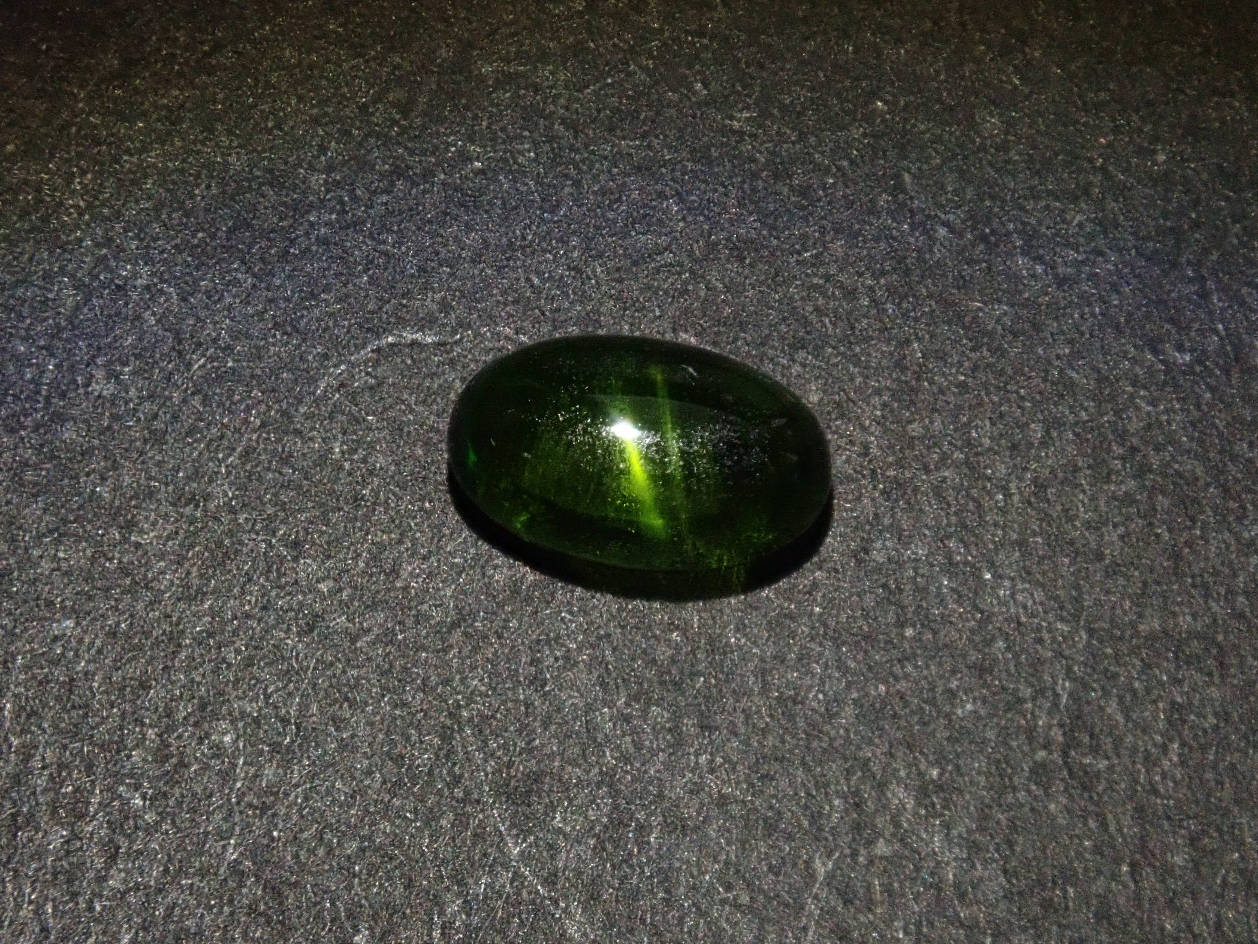 Limited to 7 stones: 1 loose enstatite cat's eye stone from Nigeria. Discounts available for multiple purchases.