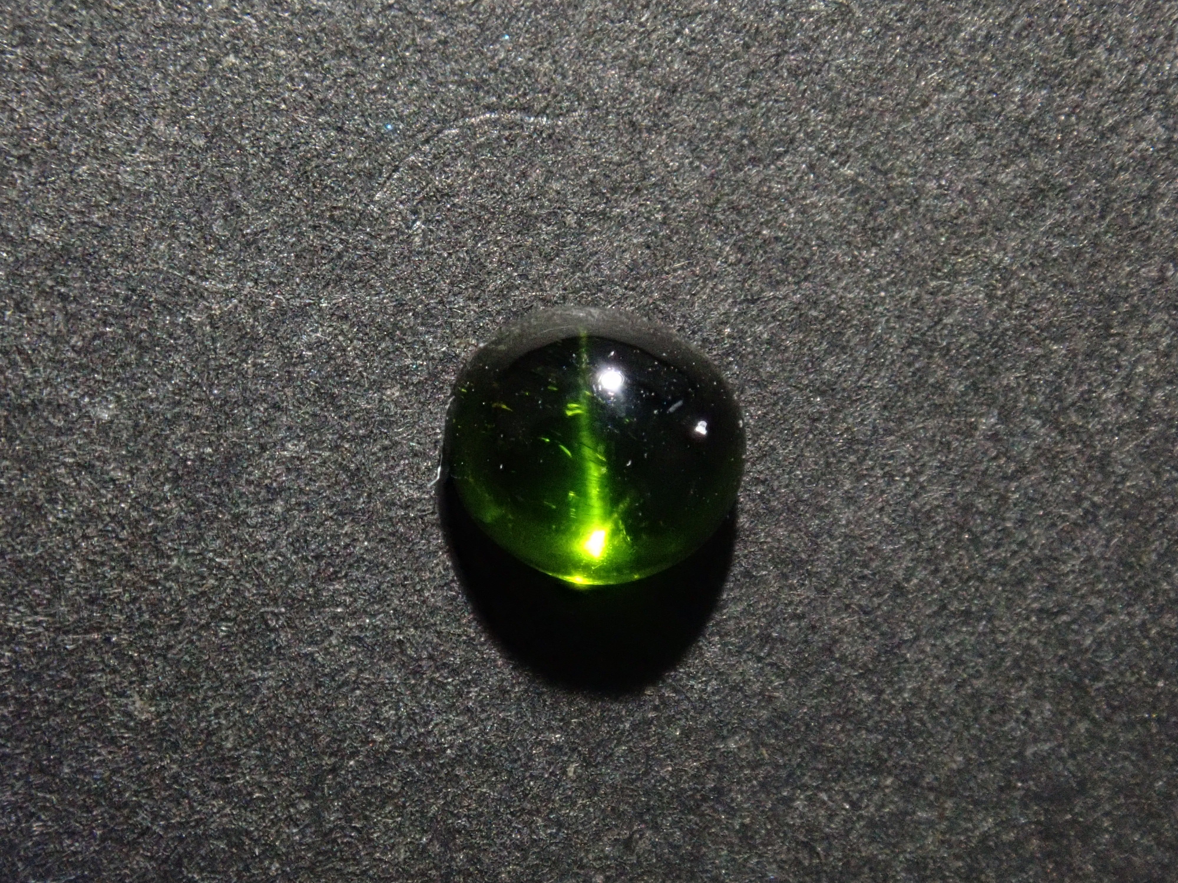 Limited to 7 stones: 1 loose enstatite cat's eye stone from Nigeria. Discounts available for multiple purchases.