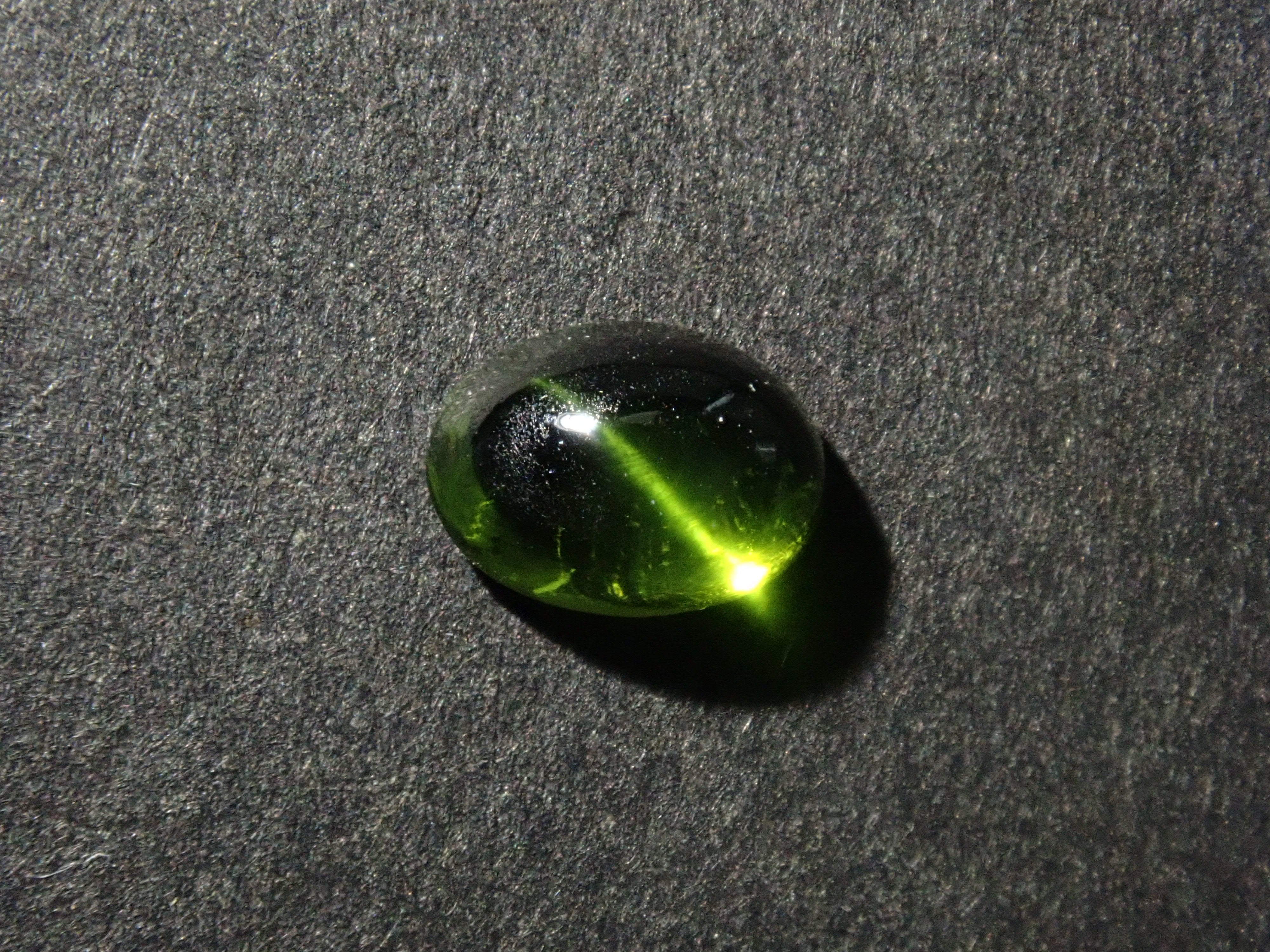 Limited to 7 stones: 1 loose enstatite cat's eye stone from Nigeria. Discounts available for multiple purchases.