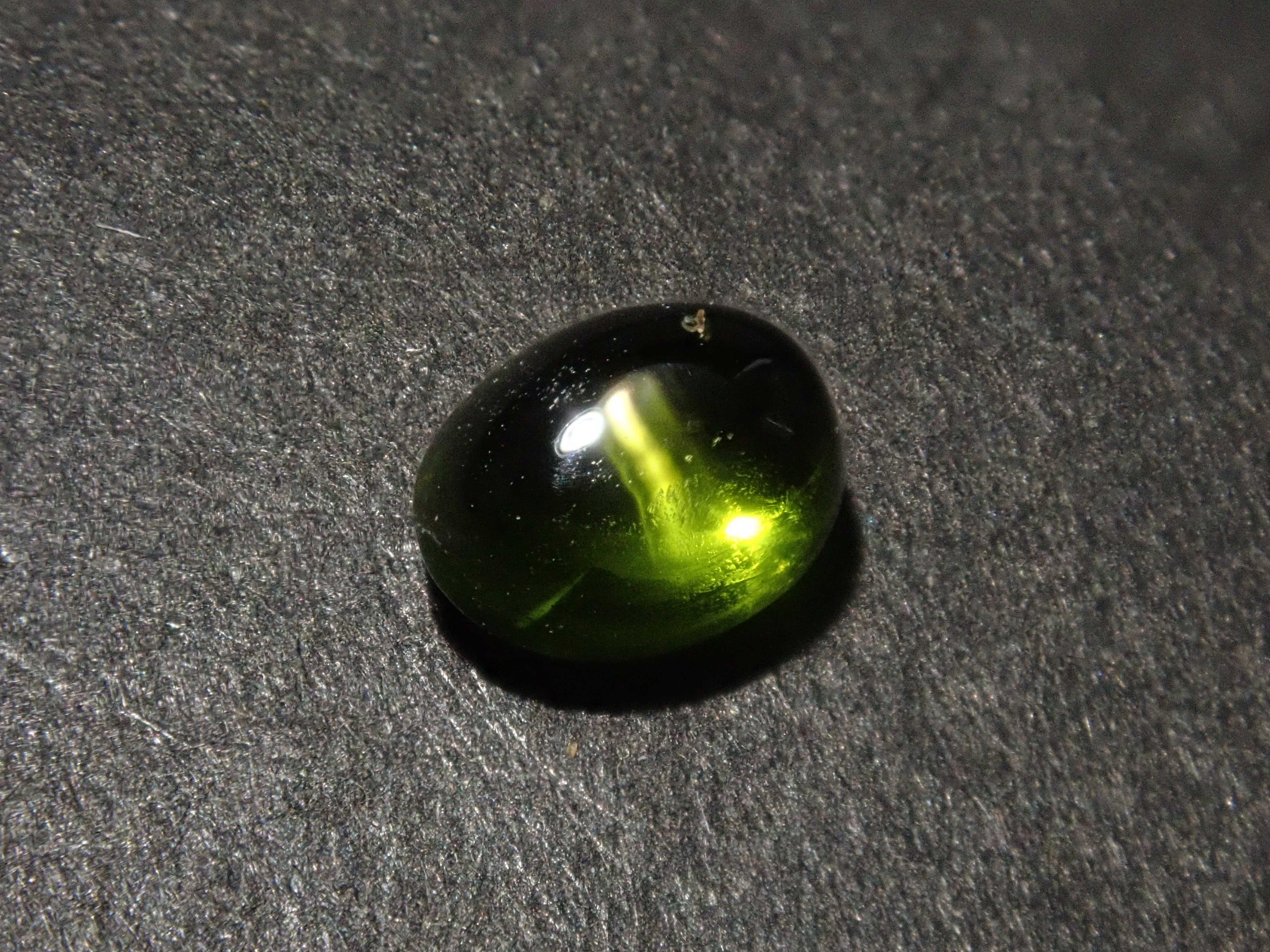 Limited to 7 stones: 1 loose enstatite cat's eye stone from Nigeria. Discounts available for multiple purchases.