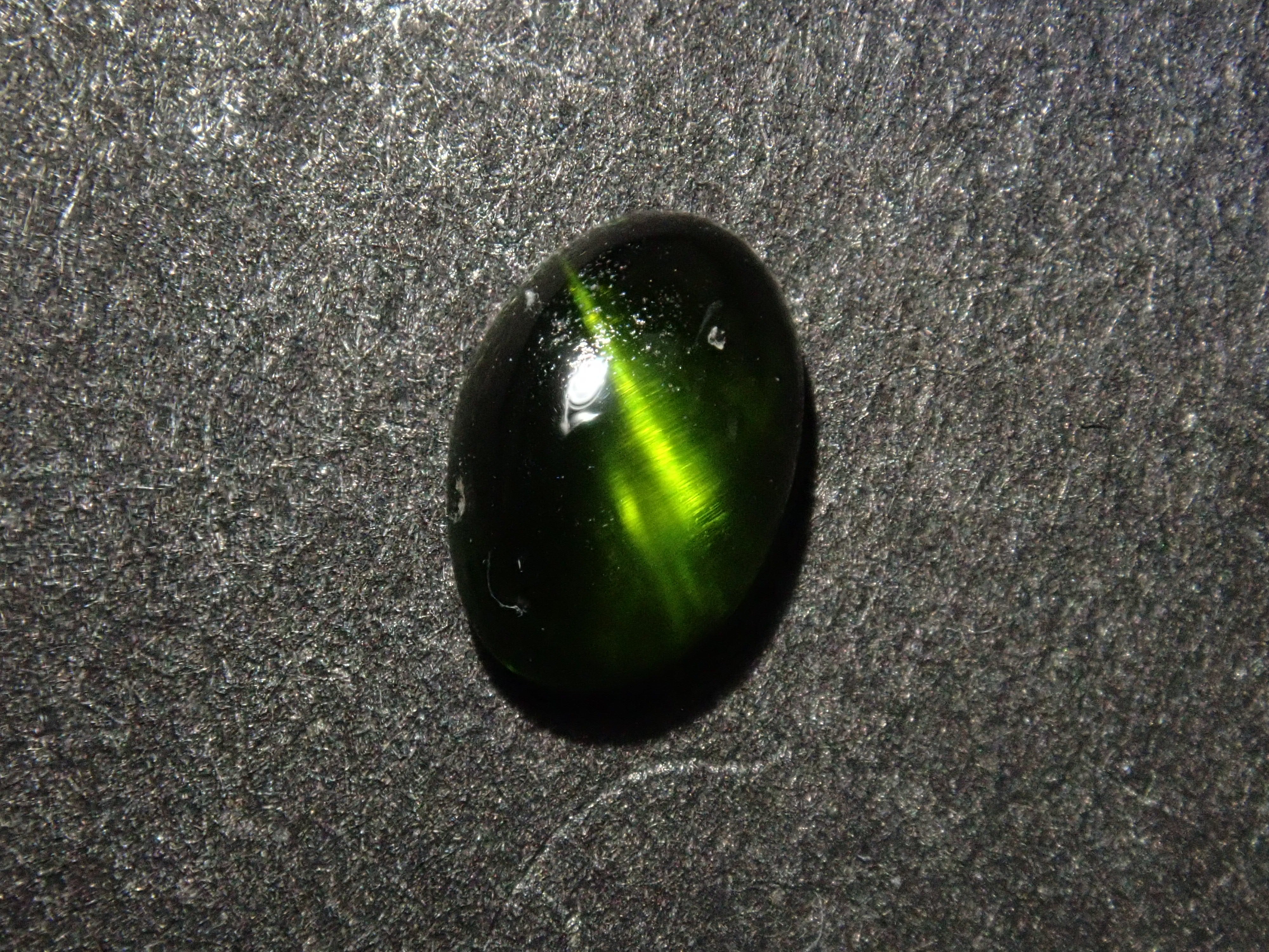 Limited to 7 stones: 1 loose enstatite cat's eye stone from Nigeria. Discounts available for multiple purchases.