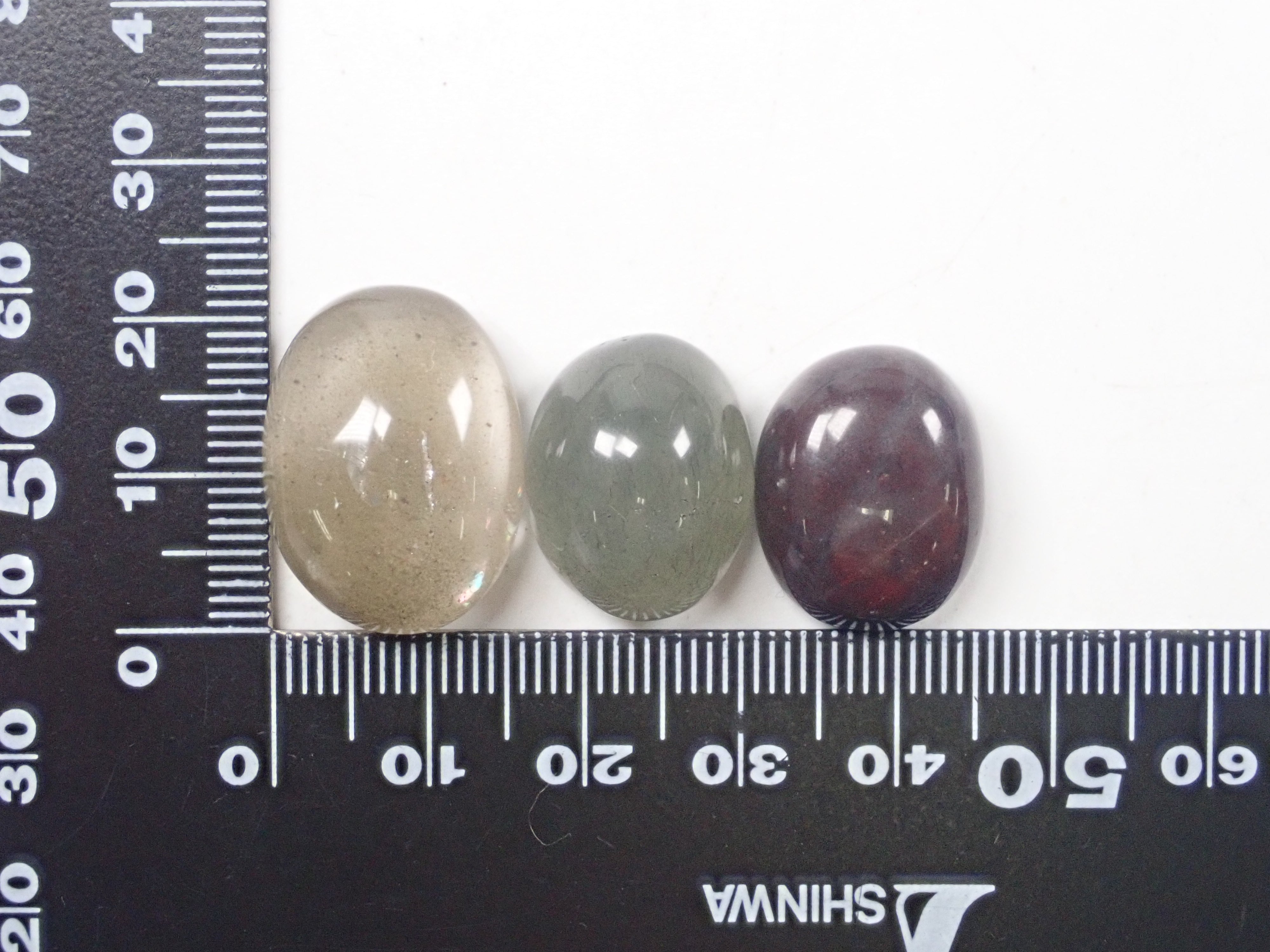 Set of 2 to 5 stones such as garden quartz and tourmaline in quartz 