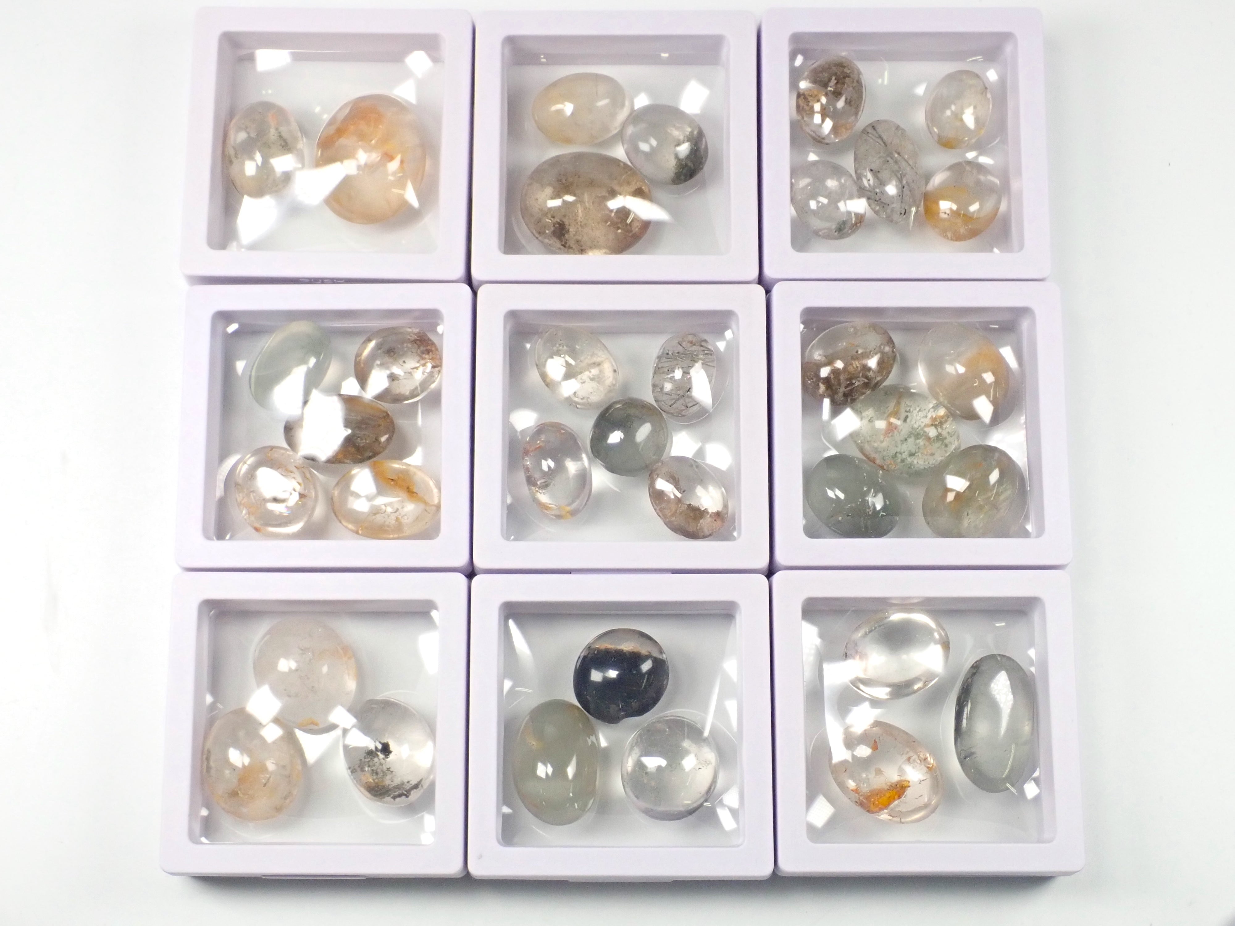 Set of 2 to 5 stones such as garden quartz and tourmaline in quartz 