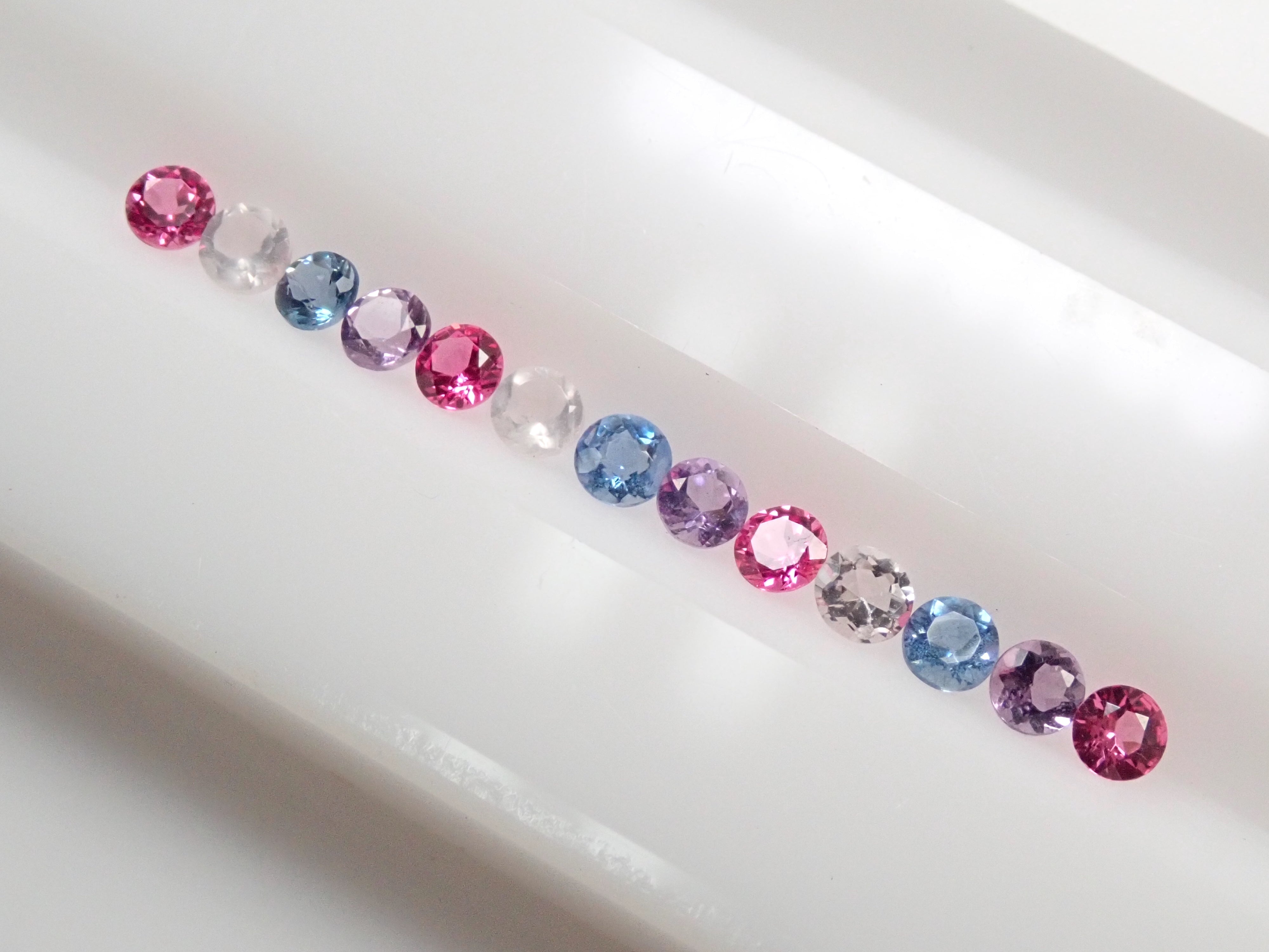 Hot pink spinel, rose quartz, Santa Maria aquamarine, and amethyst 13-stone half eternity ring set (2.0mm)