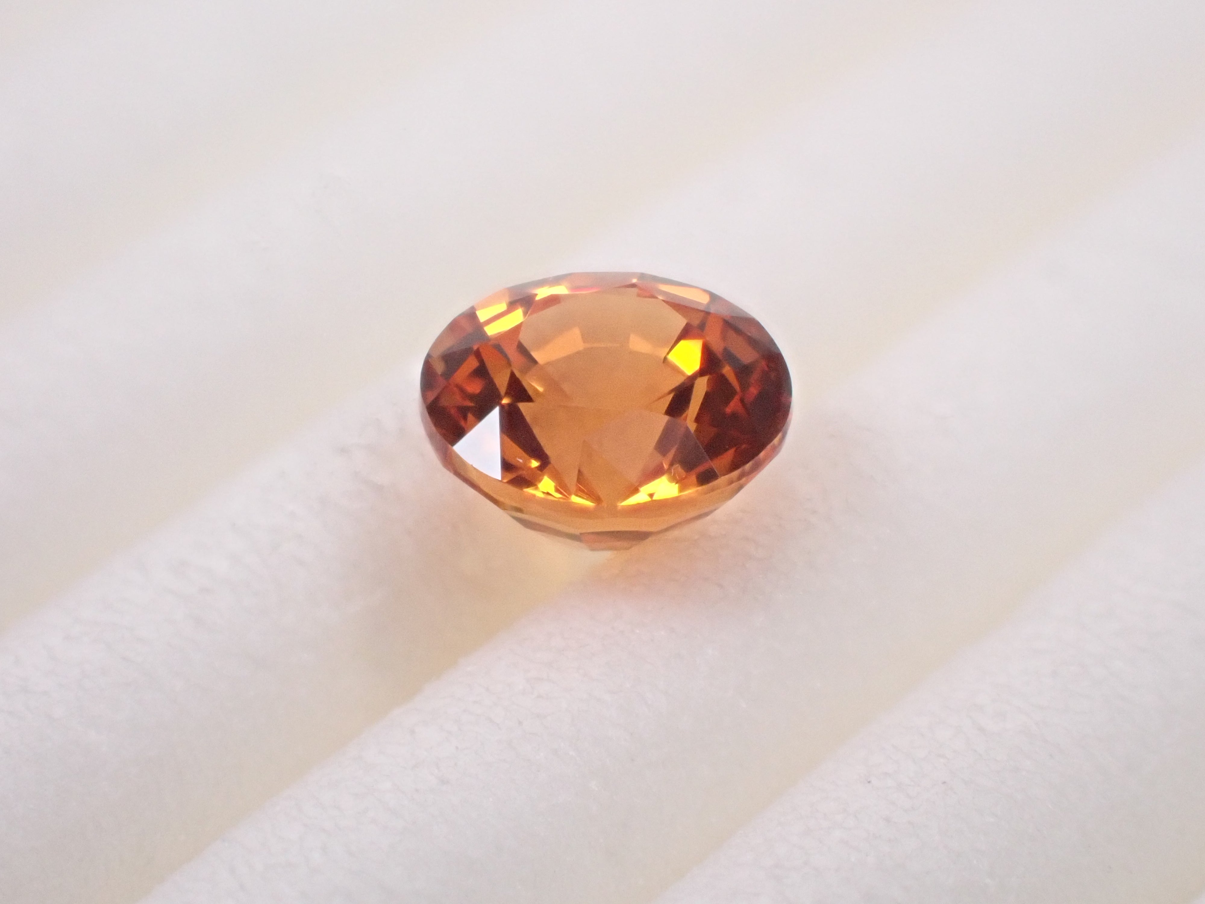 タンザニア産マンダリンガーネット 4.5mm/0.529ctルース 鑑別書