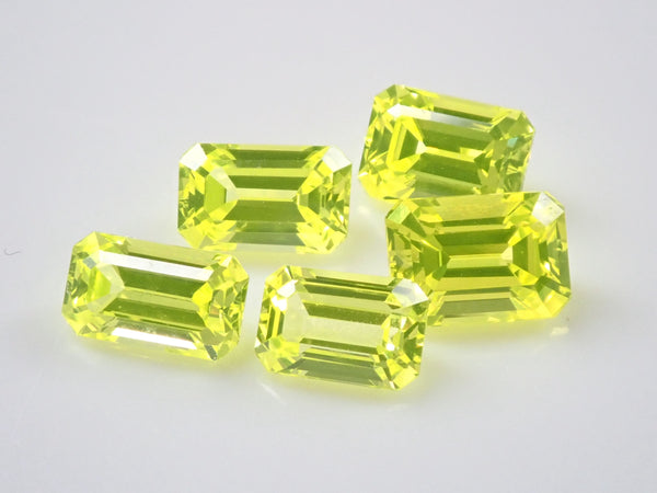 Set of 2 stones: 1 YAG (yttrium aluminum garnet) stone (canary yellow, emerald cut) + 1 yellow sapphire rough stone (discount available for multiple purchases)