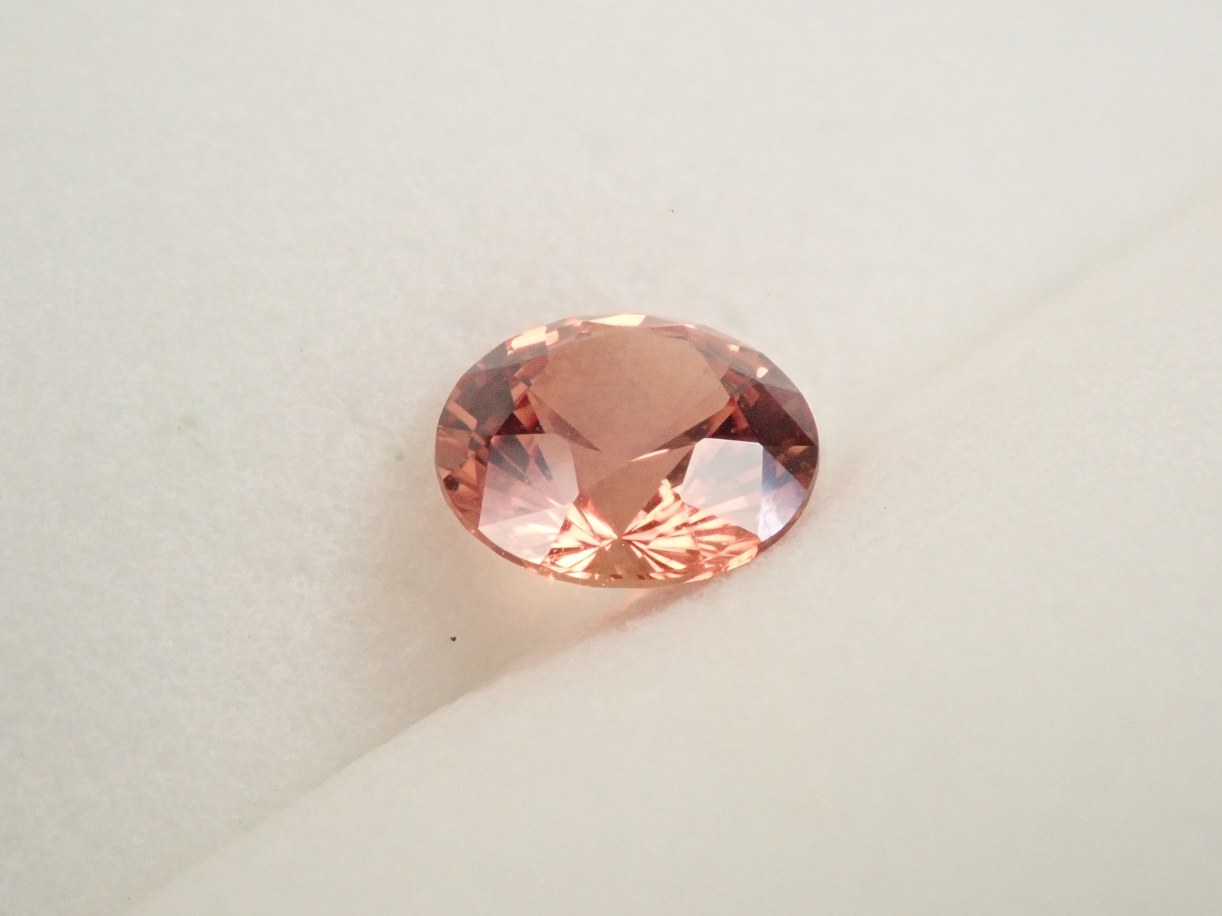 【抽選販売：10/31(金)10時am〆】マダガスカル産パパラチアサファイア 5.6mm/0.768ctルース 中央宝石研究所