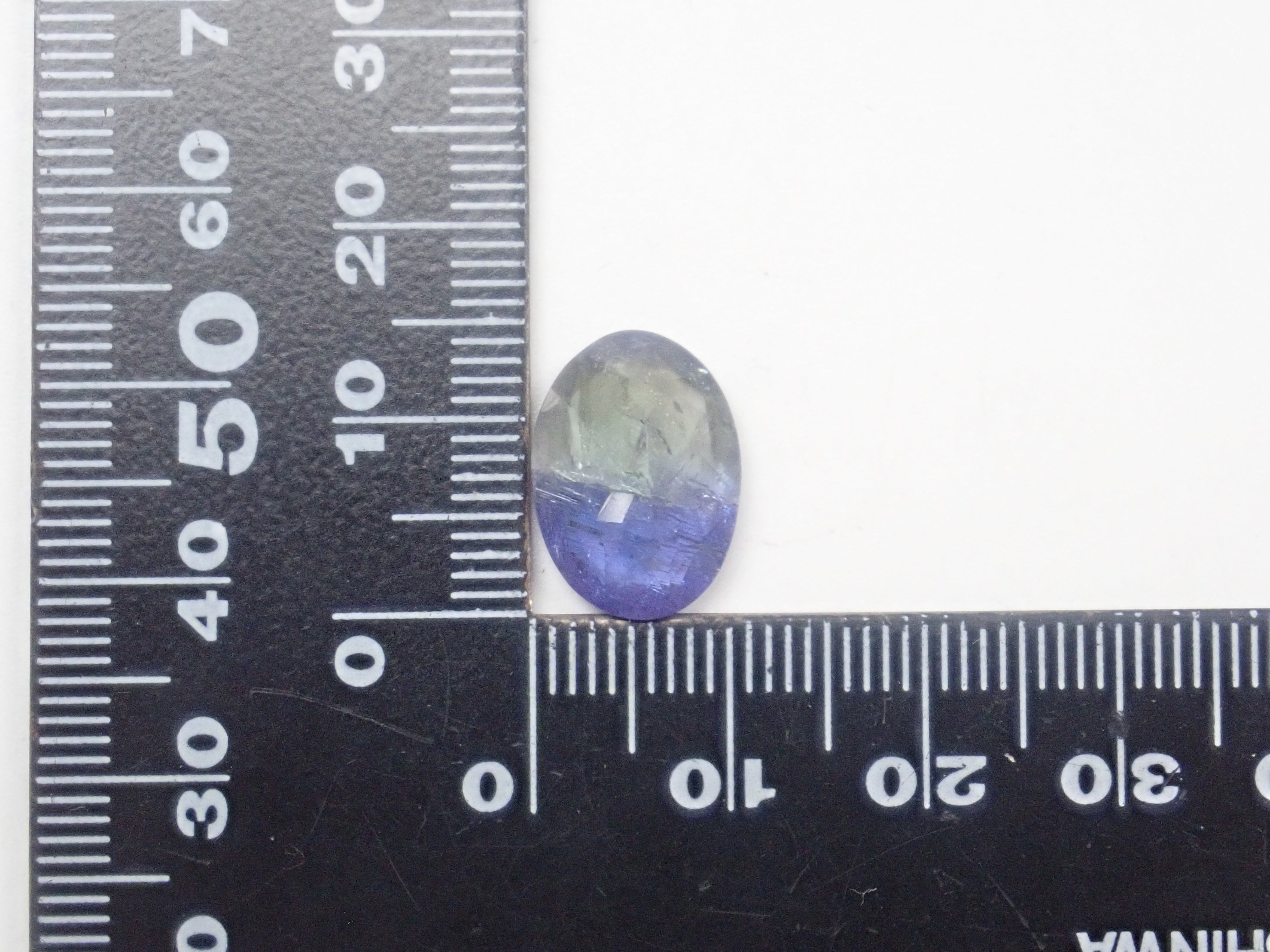 [12560872] Bicolor Tanzanite 6.351ct Loose Stone