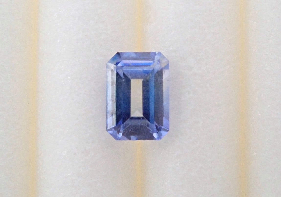 Bicolor Benitoite 0.130ct loose (emerald cut)