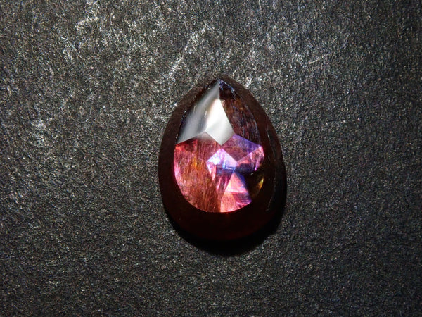 Andradite garnet (commonly known as rainbow garnet) 1.243ct rough stone