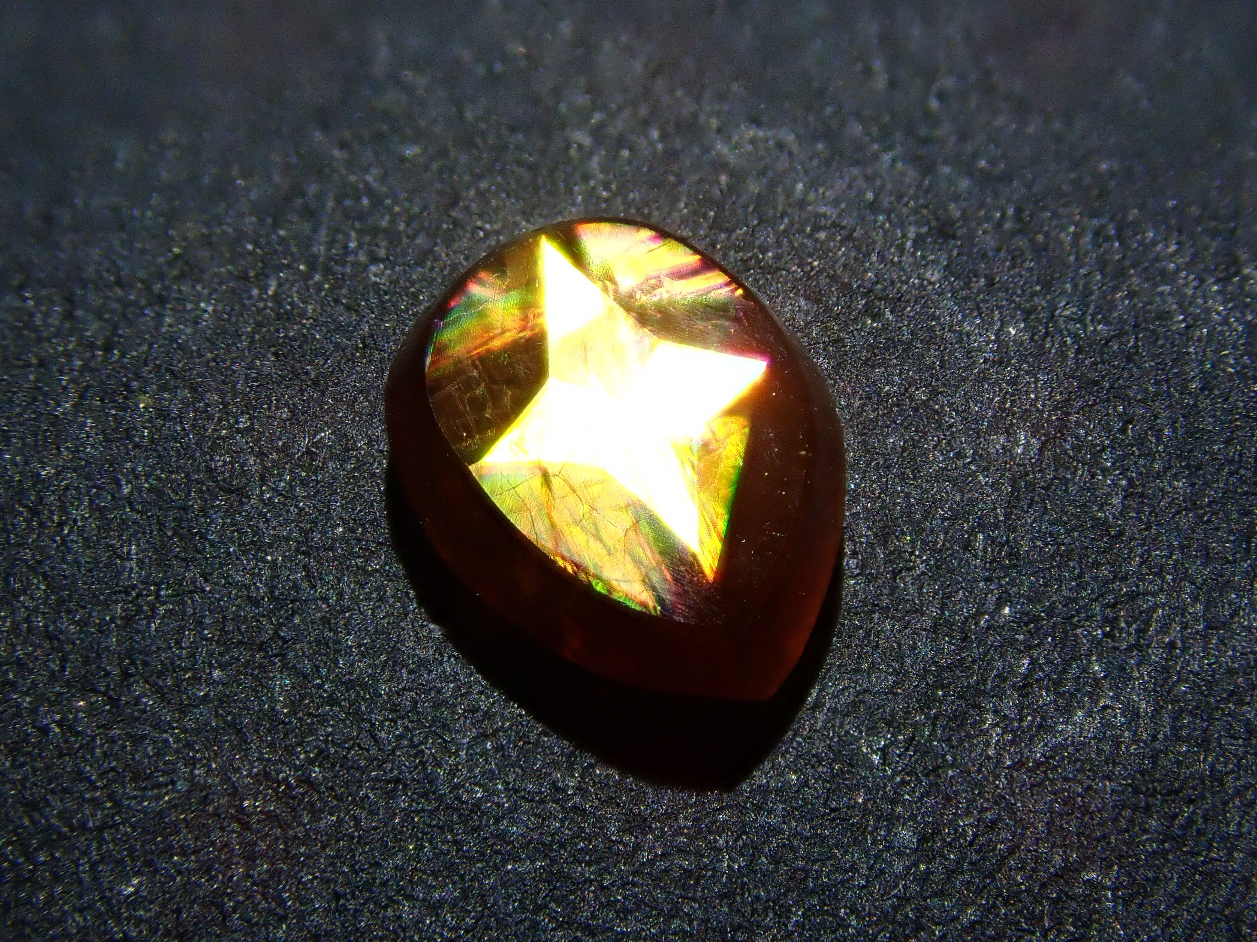 Andradite garnet (commonly known as rainbow garnet) 0.910ct rough stone