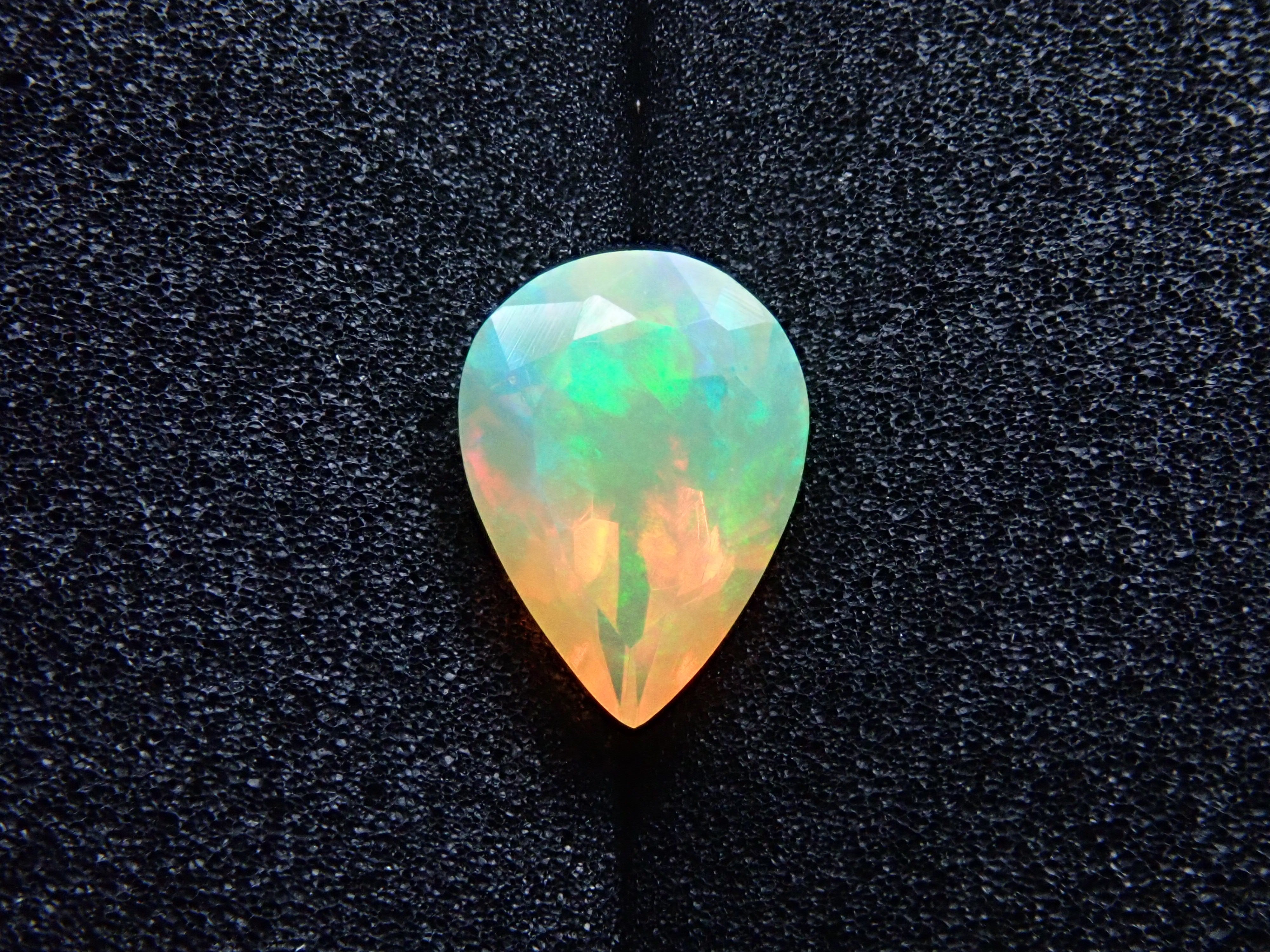 Fire opal 0.721ct loose (faceted cut)