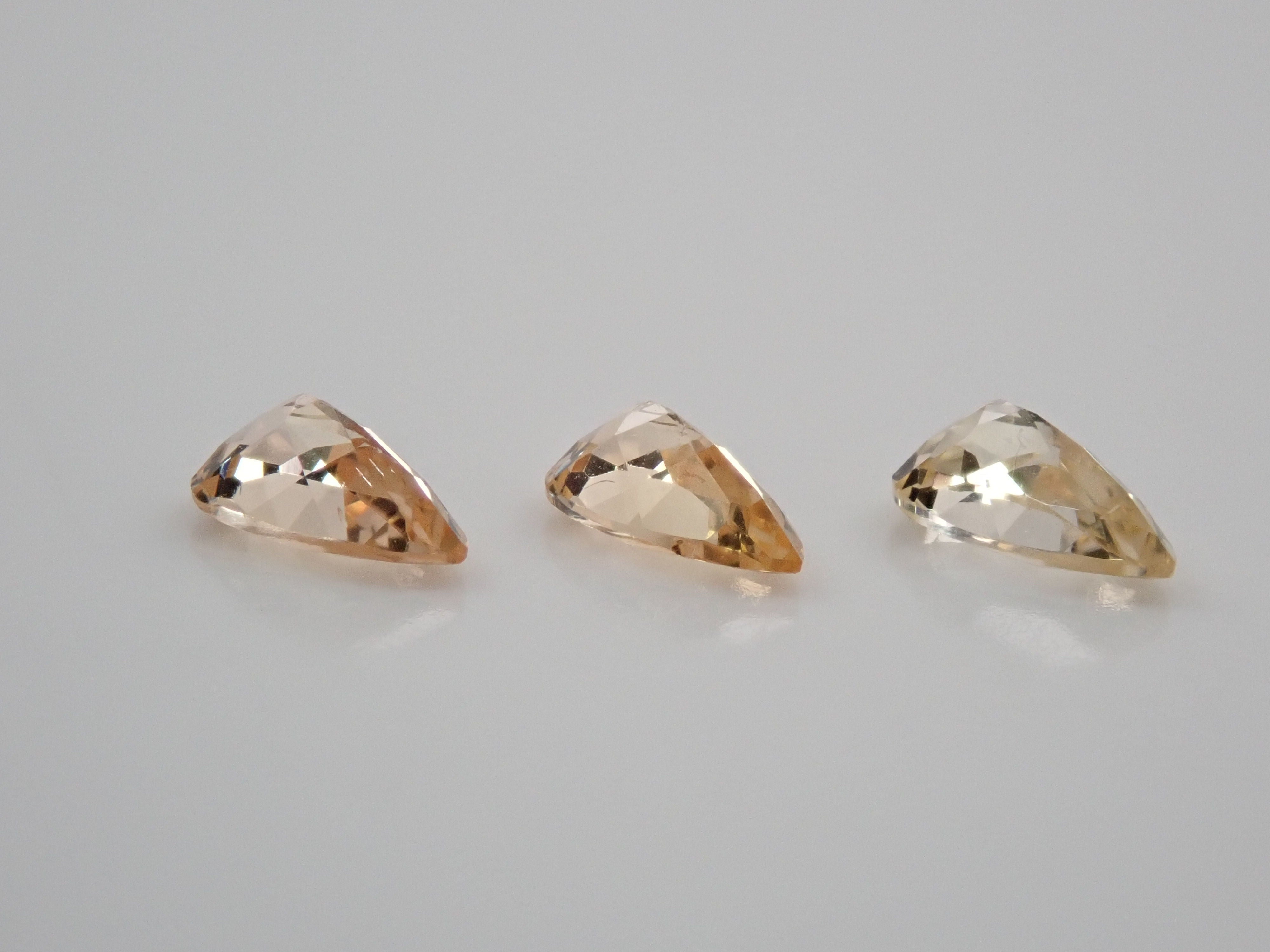 Imperial topaz 3 stone set 0.569ct