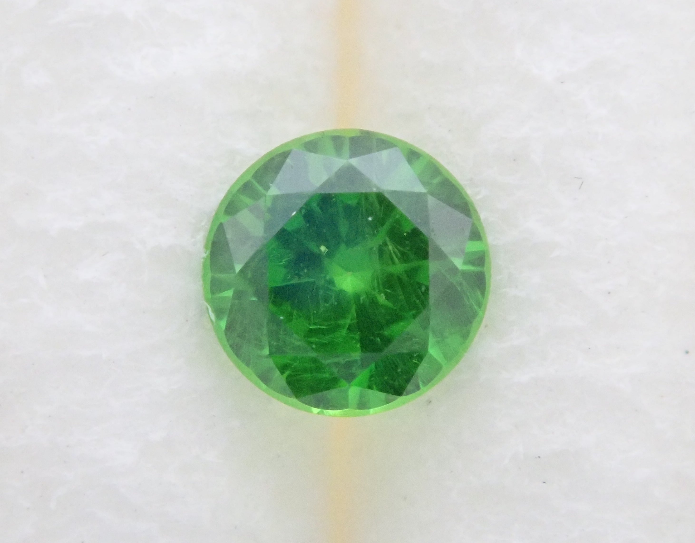 Russian demantoid garnet (horsetail recognized) 3.8mm/0.109ct loose