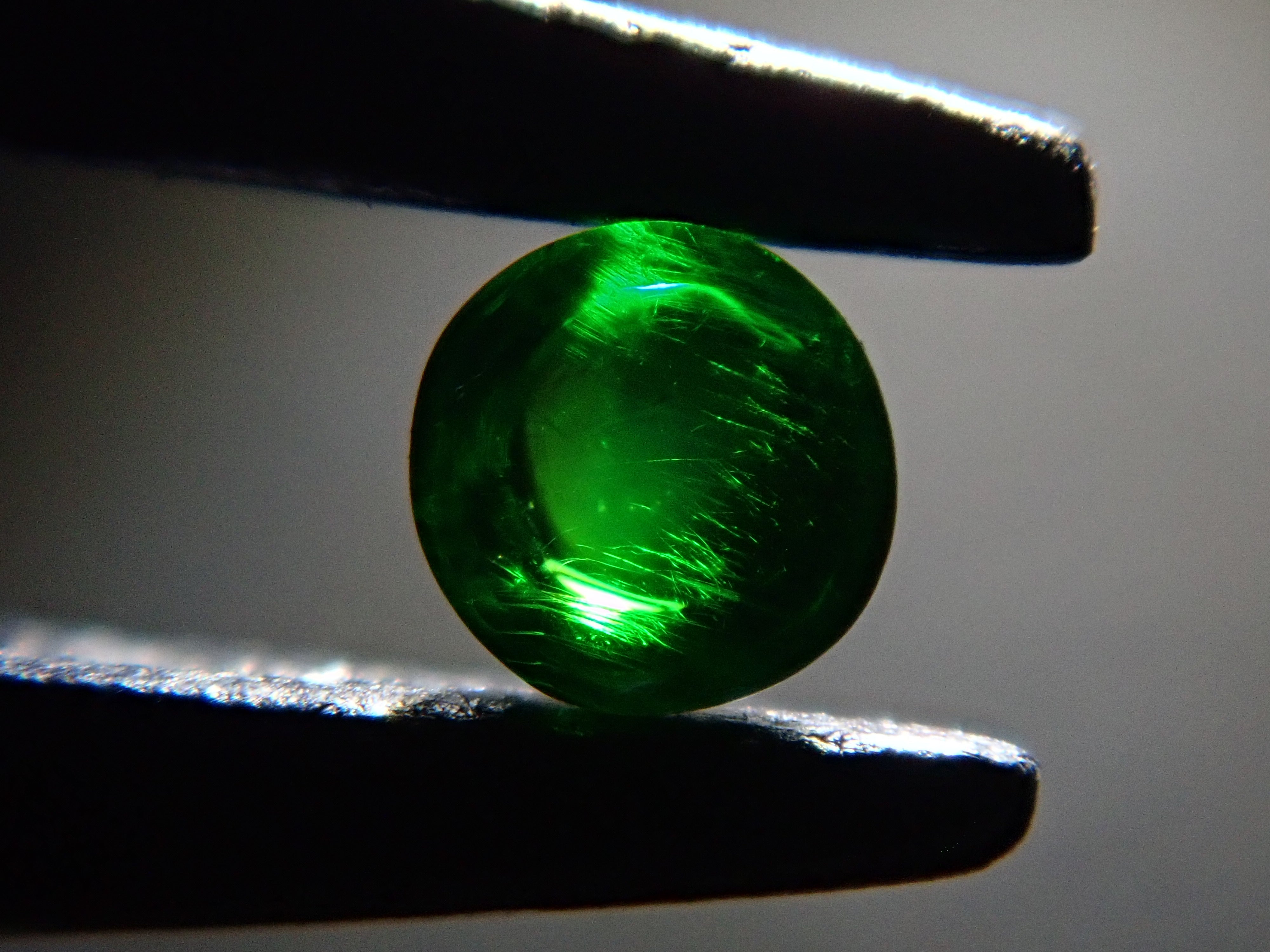 Russian demantoid garnet (horsetail recognized) 2mm/0.057ct loose