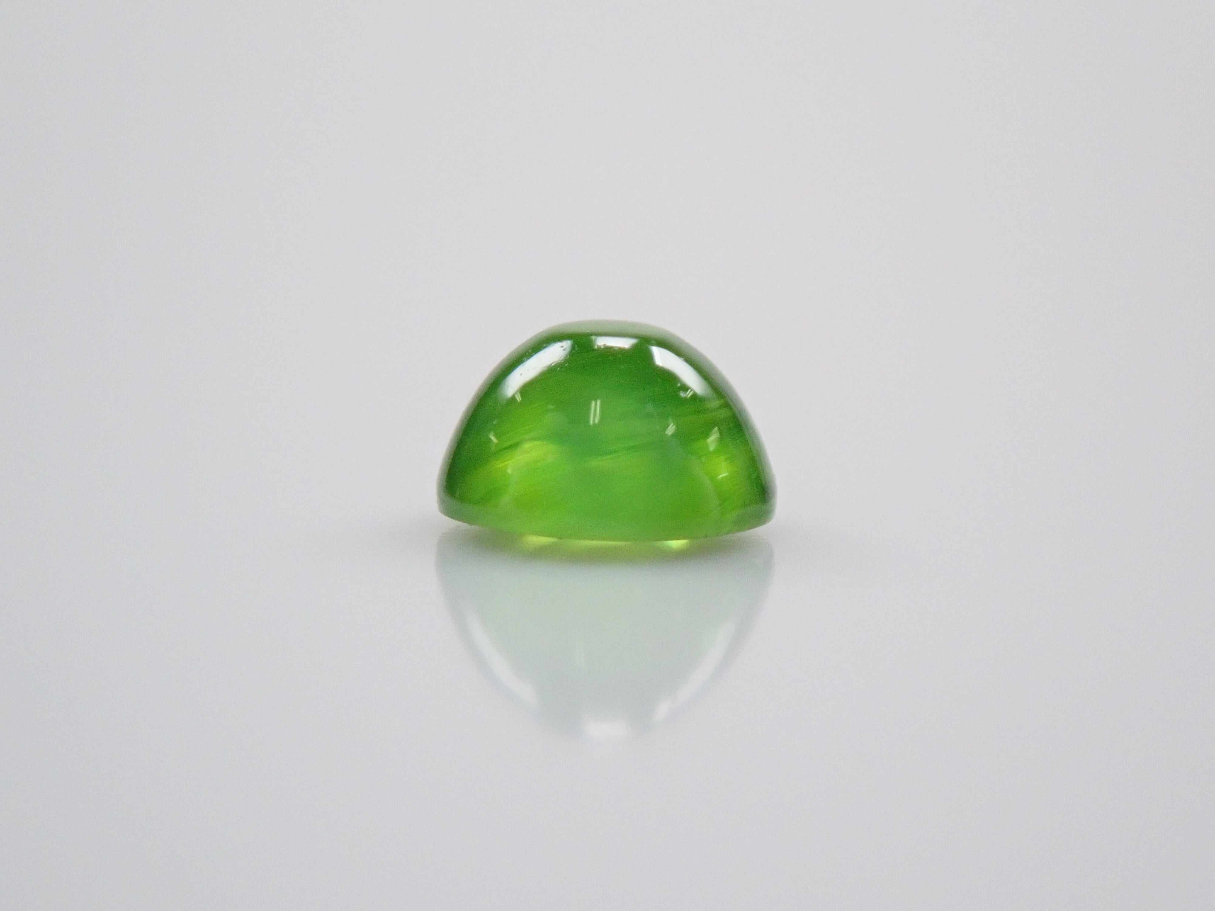 Russian demantoid garnet cat's eye (horsetail recognized) 0.138ct loose