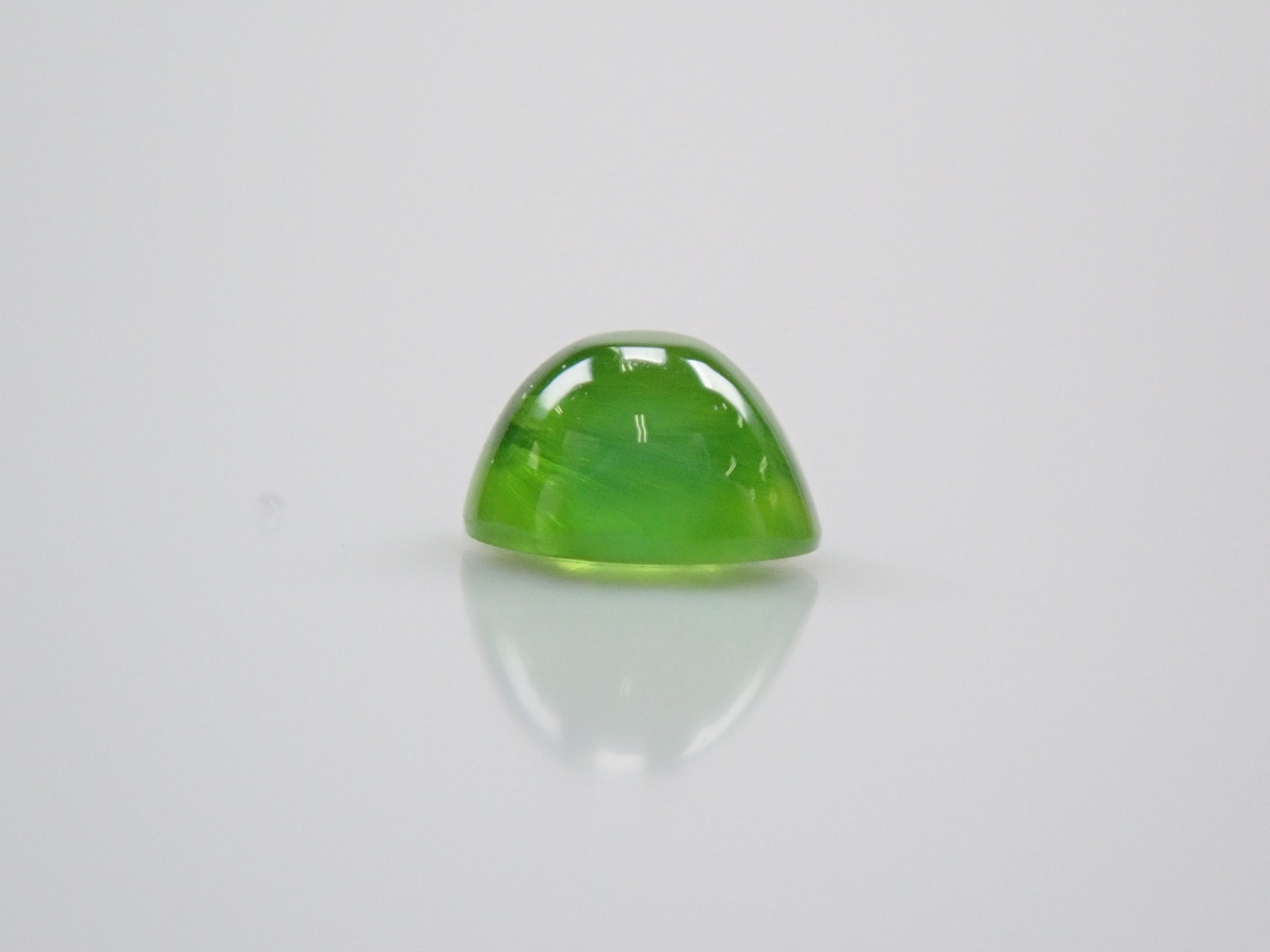 Russian demantoid garnet cat's eye (horsetail recognized) 0.138ct loose