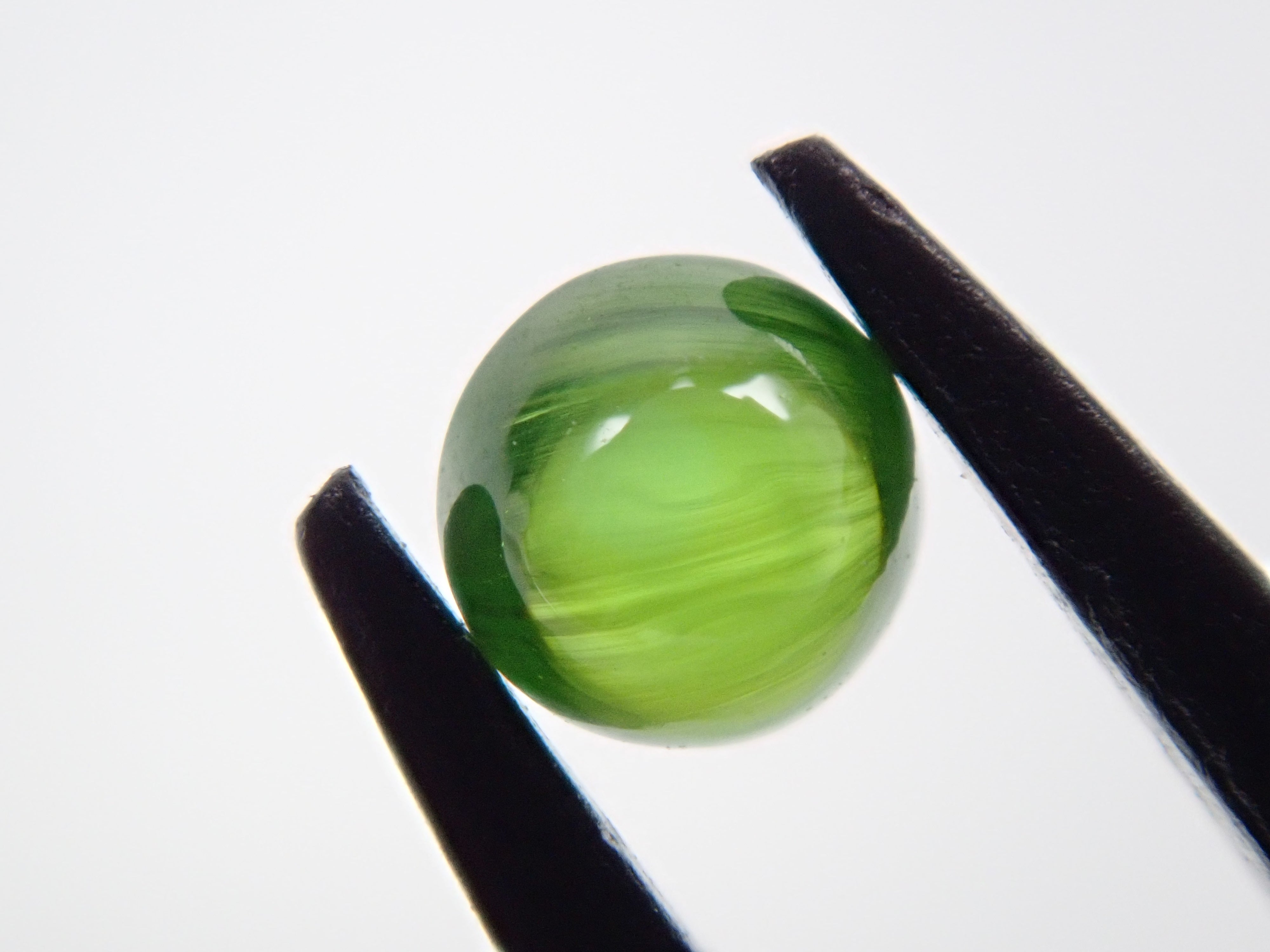 Russian demantoid garnet cat's eye (horsetail recognized) 0.138ct loose