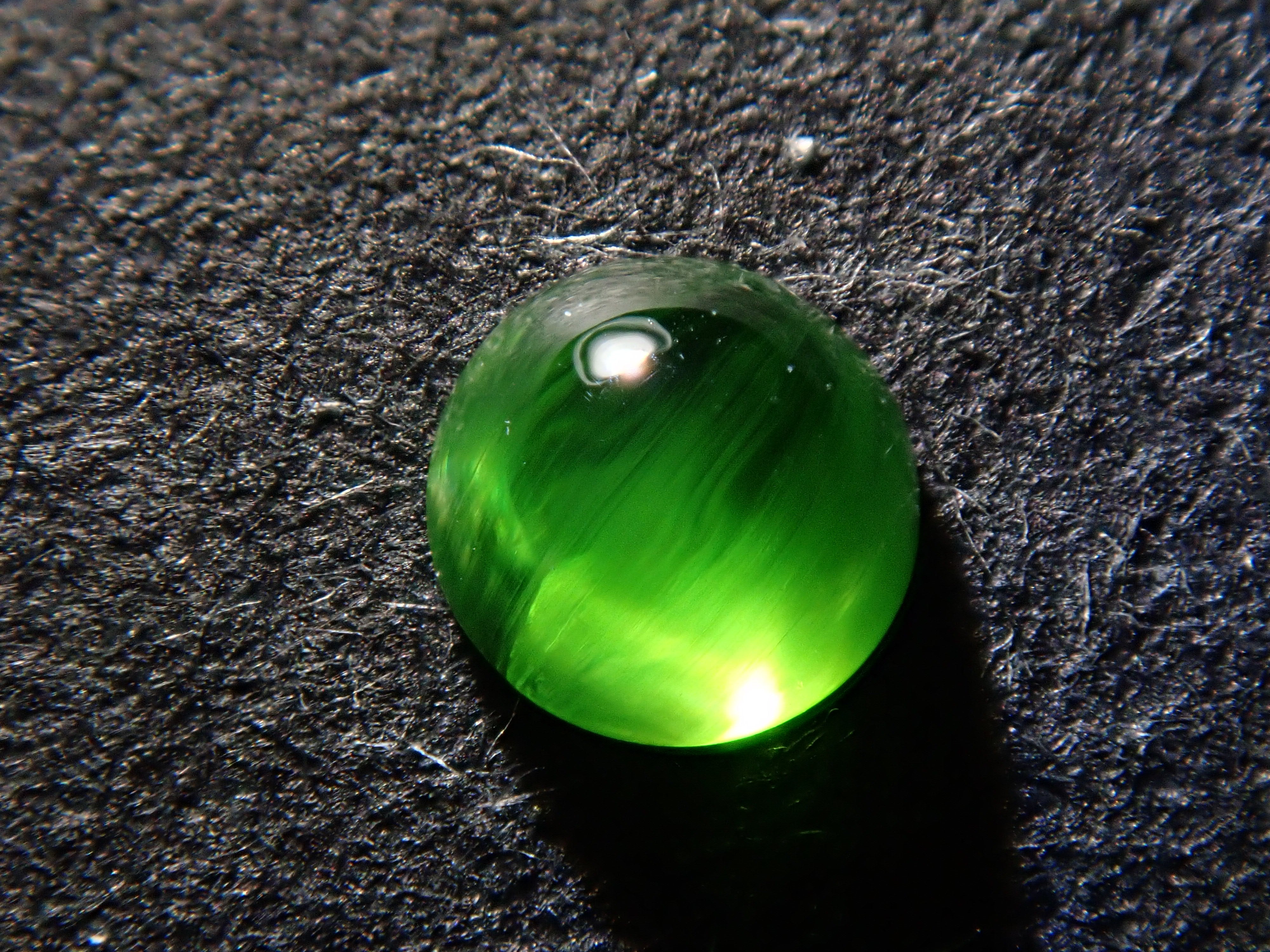 Russian demantoid garnet cat's eye (horsetail recognized) 0.138ct loose