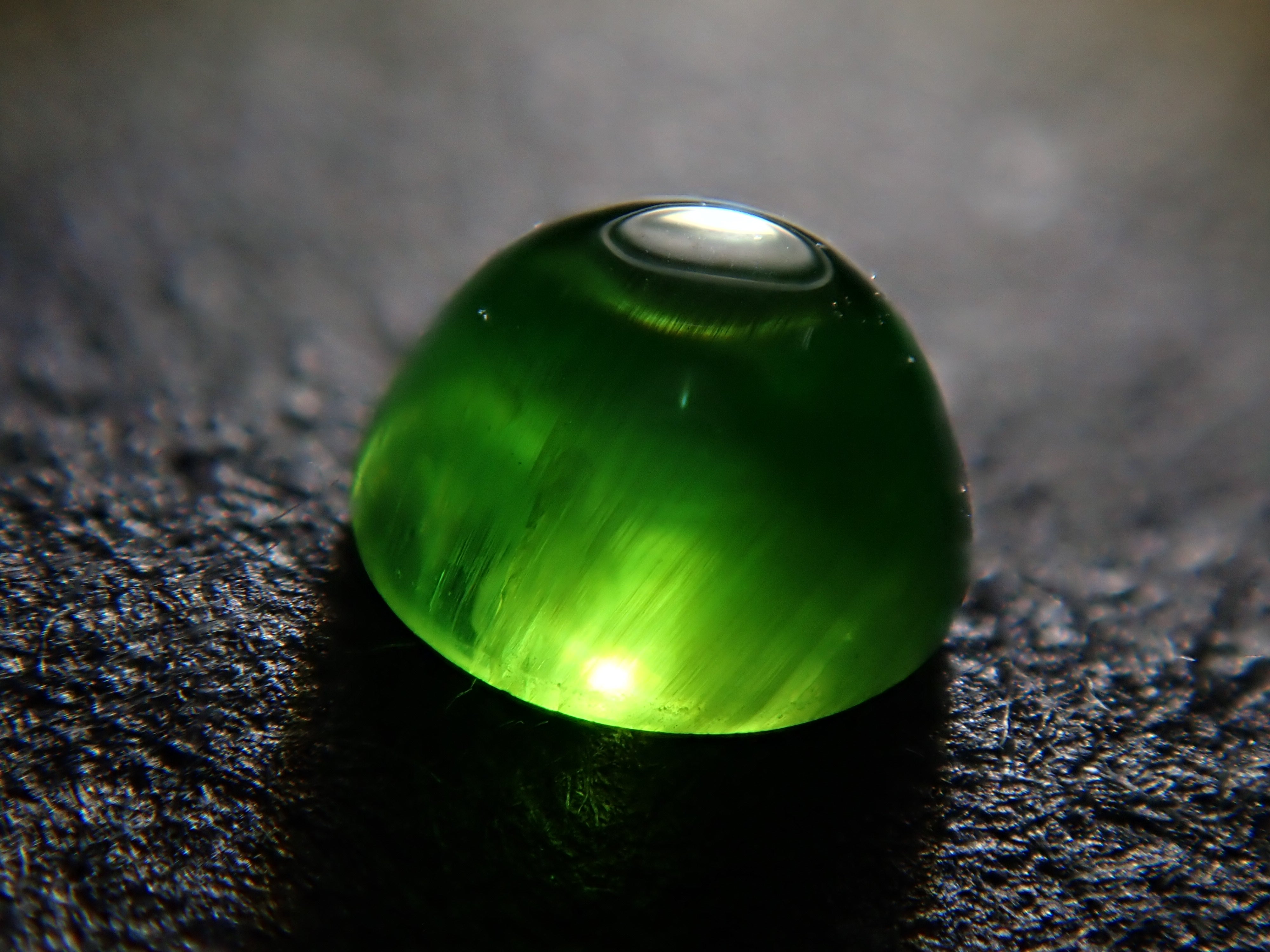 Russian demantoid garnet cat's eye (horsetail recognized) 0.138ct loose