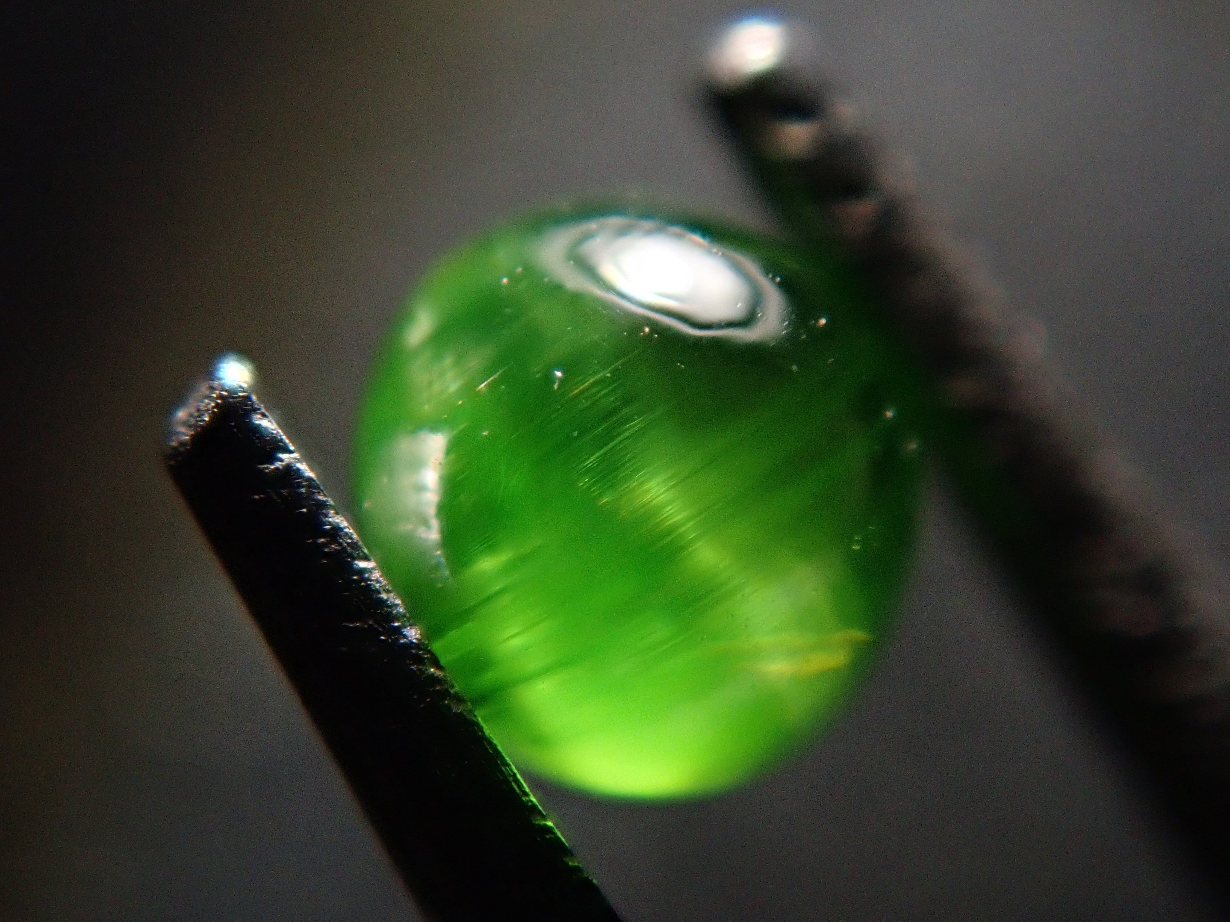 Russian demantoid garnet cat's eye (horsetail recognized) 0.138ct loose