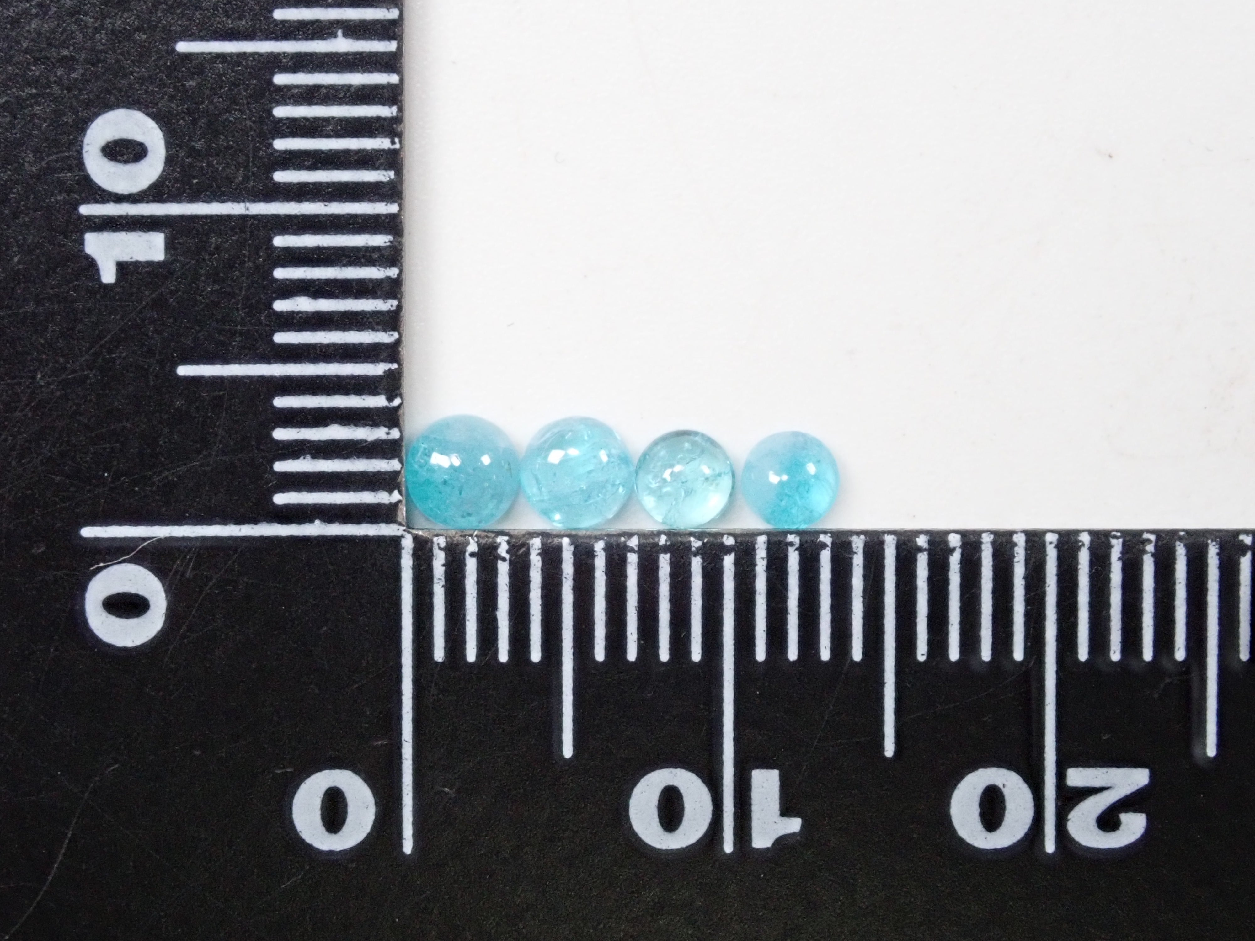 1 Brazilian Paraiba tourmaline stone (cabochon cut, average 0.25 ct)