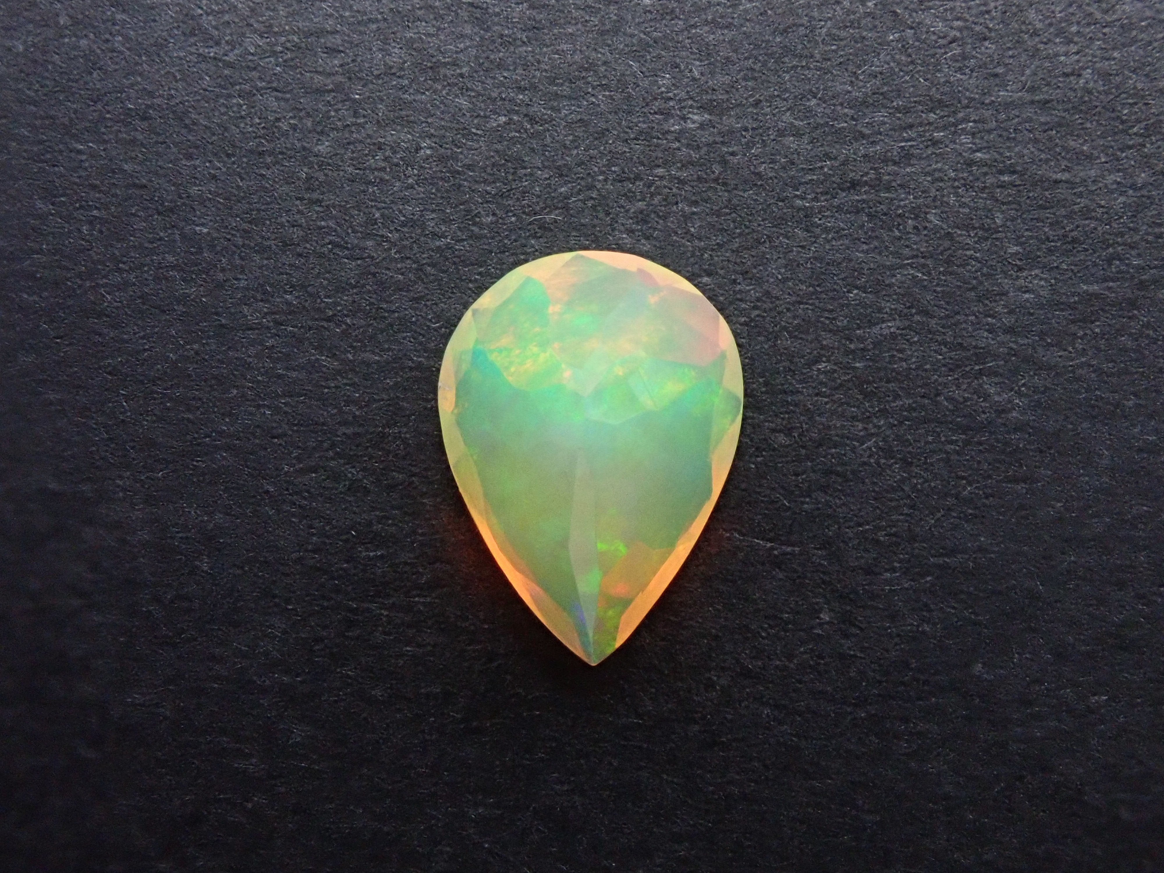 Fire opal 0.721ct loose (faceted cut)