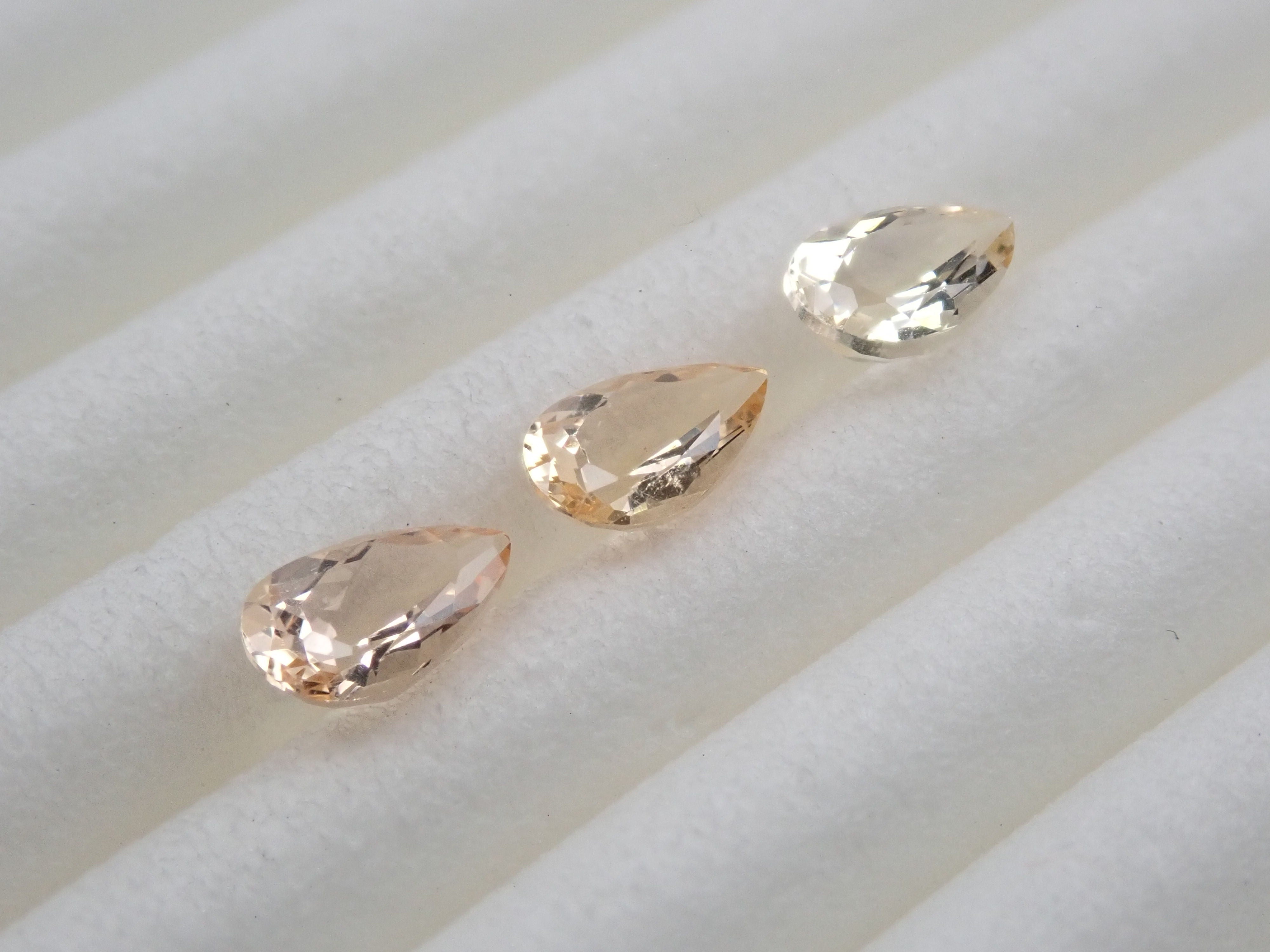 Imperial topaz 3 stone set 0.569ct